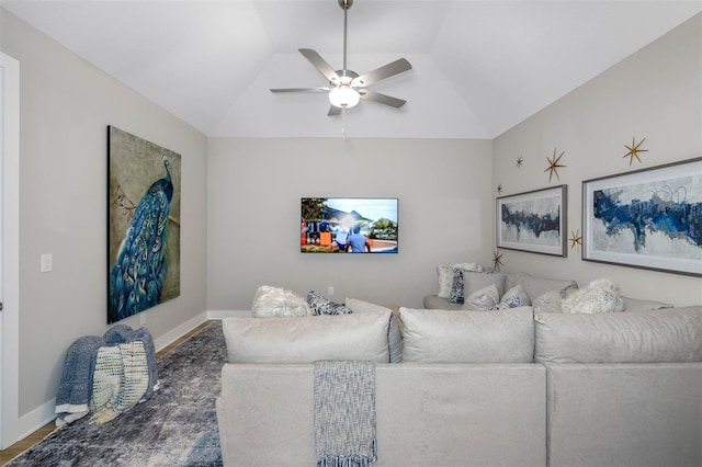 13167 Oldenburg Dr, Hudson, FL 34667 - living area featuring ceiling fan, vaulted ceiling, wood finished floors, and baseboards