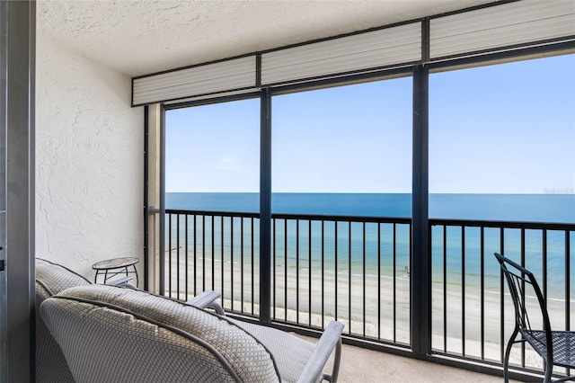 14950 Gulf Blvd Unit 905, Madeira Beach, FL 33708 - sunroom / solarium featuring view of water and beach