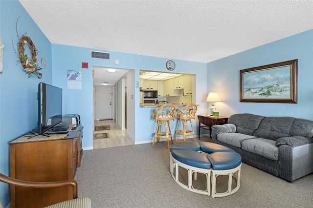 14950 Gulf Blvd Unit 905, Madeira Beach, FL 33708 - living area with light carpet, a textured ceiling, and baseboards