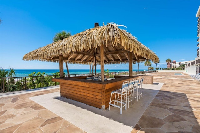 14950 Gulf Blvd Unit 905, Madeira Beach, FL 33708 - view of patio featuring a water view and a gazebo