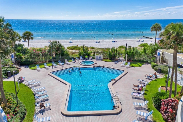 14950 Gulf Blvd Unit 905, Madeira Beach, FL 33708 - community pool featuring a hot tub and view of water and beach