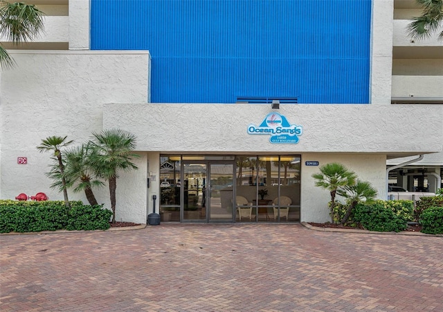 14950 Gulf Blvd Unit 905, Madeira Beach, FL 33708 - doorway to property featuring stucco siding