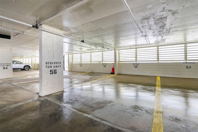 14950 Gulf Blvd Unit 905, Madeira Beach, FL 33708 - parking deck featuring concrete block wall