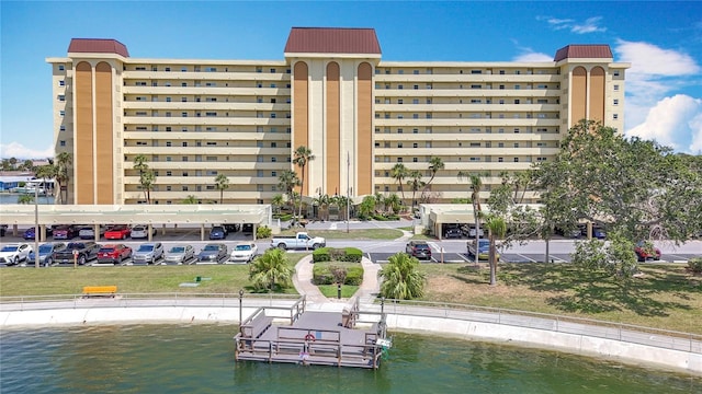 4725 Cove Cir Unit 908, Saint Petersburg, FL 33708 - view of building exterior with a water view and uncovered parking