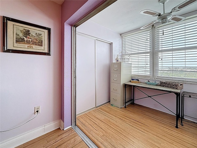 4725 Cove Cir Unit 908, Saint Petersburg, FL 33708 - unfurnished office featuring light wood-style flooring, a ceiling fan, and baseboards