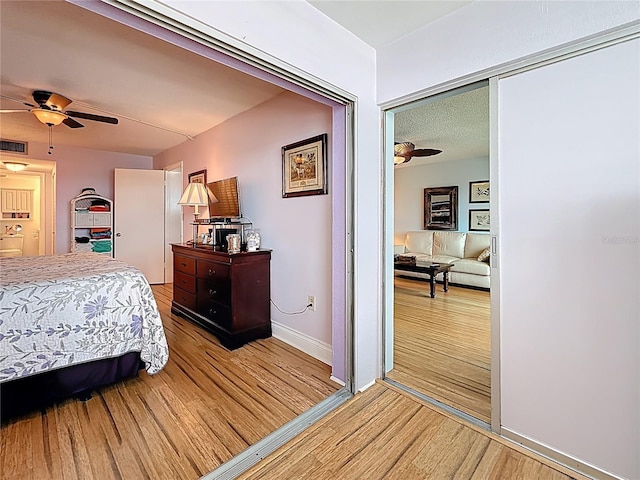 4725 Cove Cir Unit 908, Saint Petersburg, FL 33708 - bedroom with light wood-style flooring and baseboards