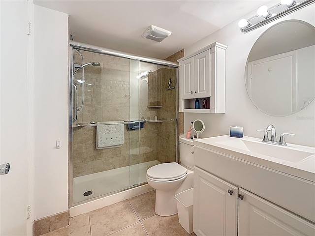 4725 Cove Cir Unit 908, Saint Petersburg, FL 33708 - bathroom featuring tile patterned floors, vanity, toilet, and a stall shower