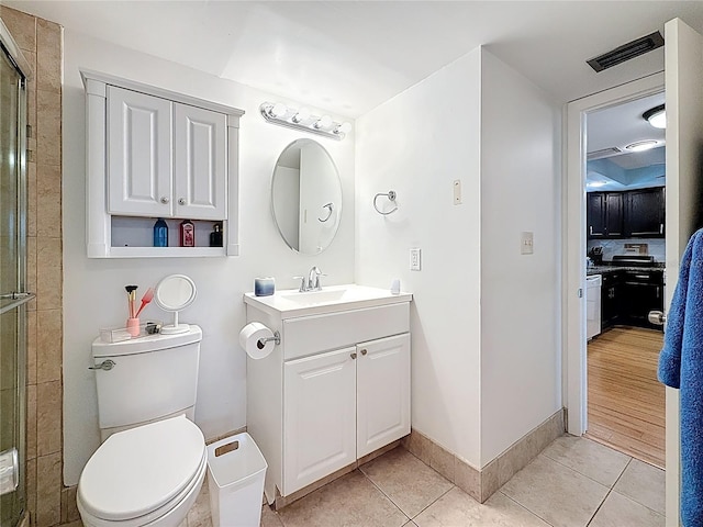 4725 Cove Cir Unit 908, Saint Petersburg, FL 33708 - bathroom with vanity, a shower stall, toilet, and tile patterned flooring
