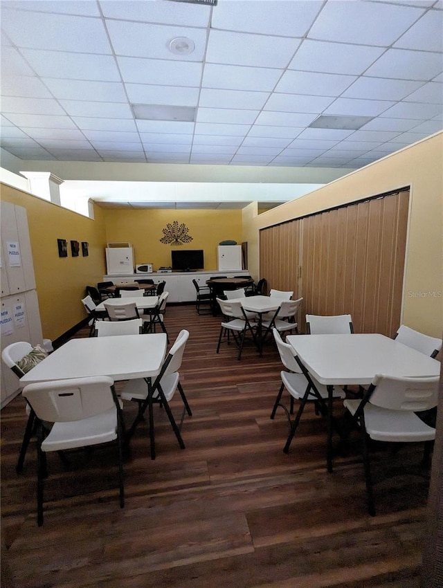 4725 Cove Cir Unit 908, Saint Petersburg, FL 33708 - dining space with wood finished floors and a paneled ceiling