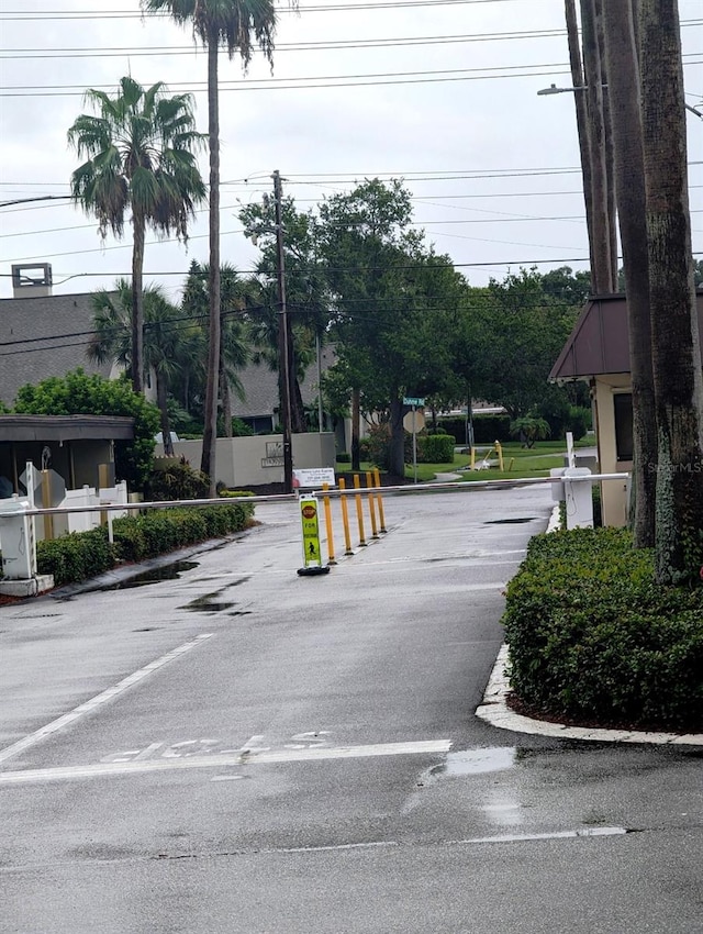 4725 Cove Cir Unit 908, Saint Petersburg, FL 33708 - view of asphalt street featuring street lighting and traffic signs