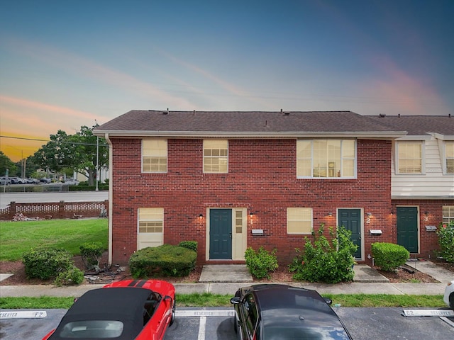 1920 E Edgewood Dr Unit E1, Lakeland, FL 33803 - townhome / multi-family property featuring uncovered parking and brick siding