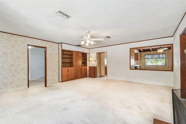 601 75th St N, Saint Petersburg, FL 33710 - unfurnished living room featuring a ceiling fan and crown molding