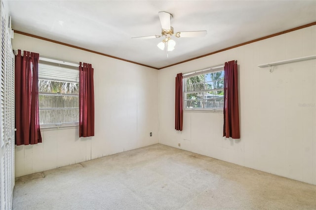 601 75th St N, Saint Petersburg, FL 33710 - carpeted spare room with ceiling fan and ornamental molding