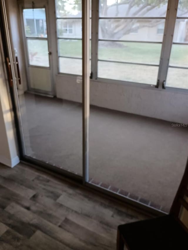 1904 Canterbury Ln Unit 18, Sun City Center, FL 33573 - unfurnished sunroom with plenty of natural light