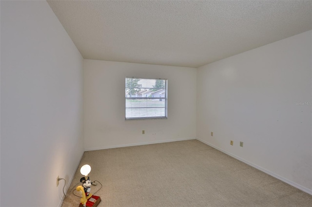 1904 Canterbury Ln Unit 18, Sun City Center, FL 33573 - unfurnished room featuring light carpet, a textured ceiling, and baseboards