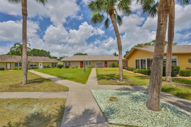 1904 Canterbury Ln Unit 18, Sun City Center, FL 33573 - ranch-style house with a front yard