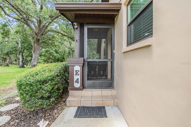 1400 Tarpon Woods Blvd Unit E4, Palm Harbor, FL 34685 - entrance to property with stucco siding