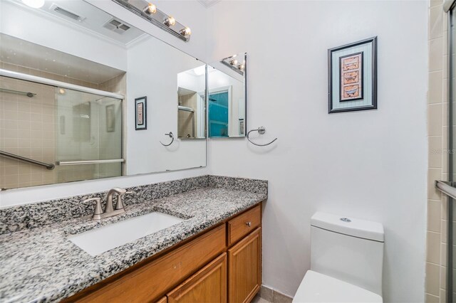 1400 Tarpon Woods Blvd Unit E4, Palm Harbor, FL 34685 - full bath featuring toilet, vanity, ornamental molding, and a tile shower