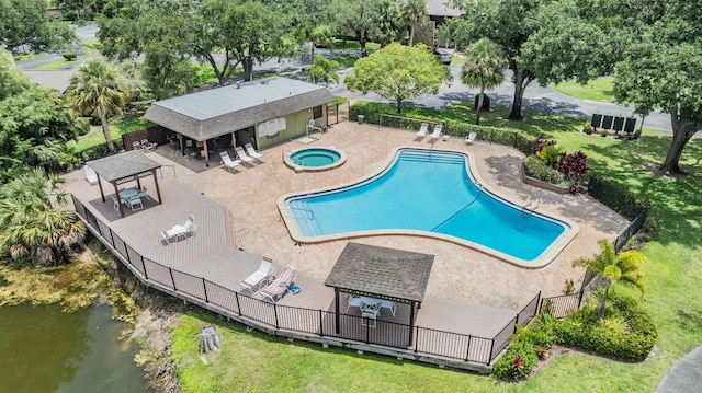 1400 Tarpon Woods Blvd Unit E4, Palm Harbor, FL 34685 - community pool with a community hot tub, a gazebo, a water view, view of scattered trees, and a patio area