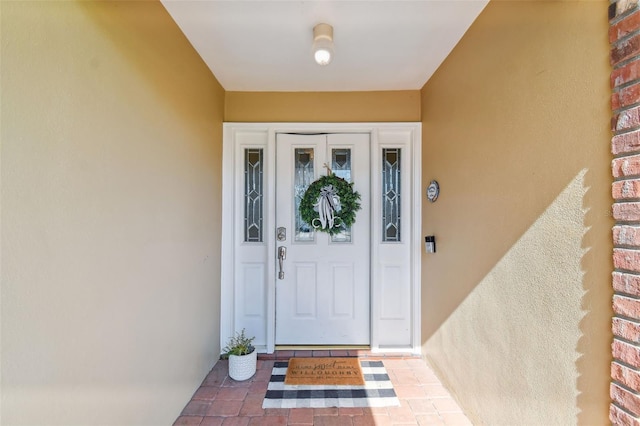 10387 Majestic Dr, Largo, FL 33774 - view of exterior entry with stucco siding