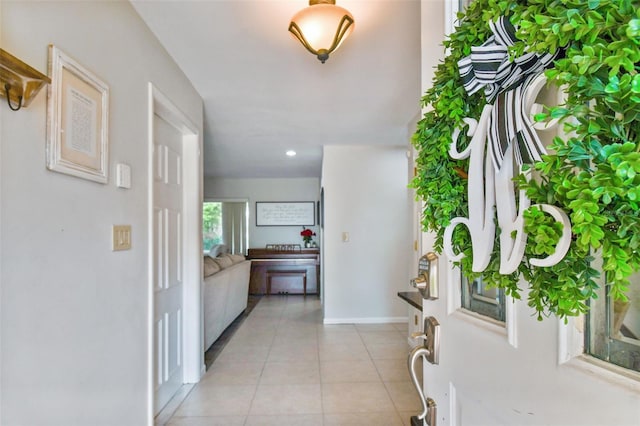 10387 Majestic Dr, Largo, FL 33774 - foyer with light tile patterned flooring, baseboards, and recessed lighting