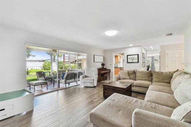 10387 Majestic Dr, Largo, FL 33774 - living area featuring wood finished floors and recessed lighting