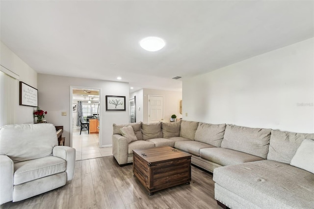 10387 Majestic Dr, Largo, FL 33774 - living room featuring light wood-type flooring and recessed lighting