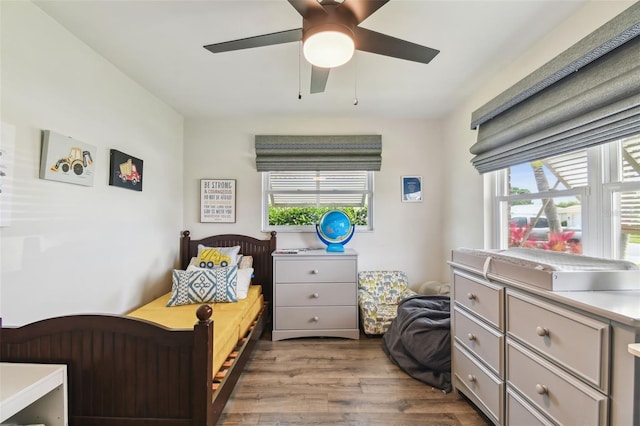 10387 Majestic Dr, Largo, FL 33774 - bedroom with wood finished floors and ceiling fan