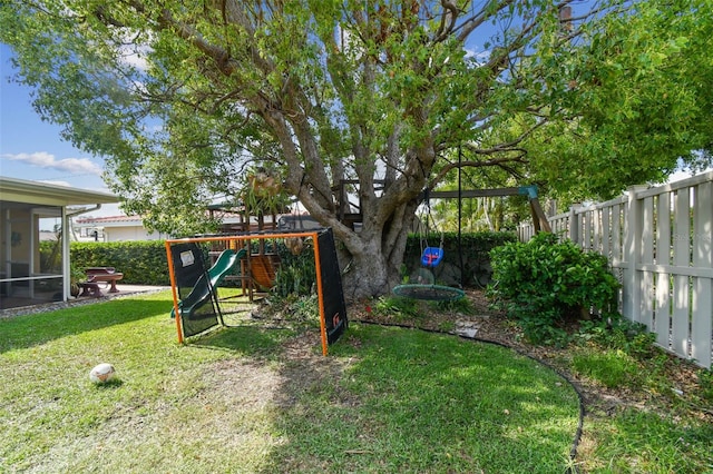 10387 Majestic Dr, Largo, FL 33774 - view of yard with a playground and a sunroom