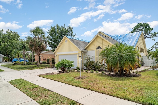 7833 Ontario Street Cir, Sarasota, FL 34243 - ranch-style home featuring driveway, a front lawn, and a garage