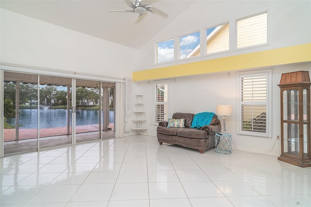 7833 Ontario Street Cir, Sarasota, FL 34243 - living area with high vaulted ceiling, ceiling fan, tile patterned floors, and baseboards