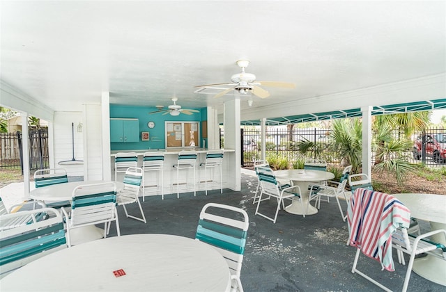 7833 Ontario Street Cir, Sarasota, FL 34243 - view of patio / terrace featuring outdoor dining area and ceiling fan