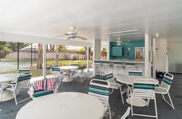 7833 Ontario Street Cir, Sarasota, FL 34243 - view of patio featuring outdoor dining area and a ceiling fan