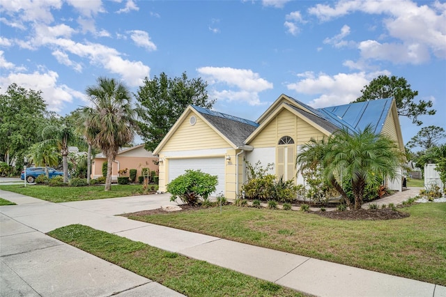 7833 Ontario Street Cir, Sarasota, FL 34243 - single story home with driveway, a front lawn, and a garage