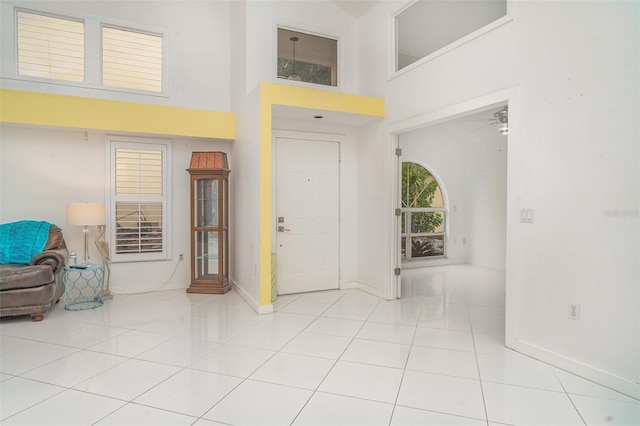 7833 Ontario Street Cir, Sarasota, FL 34243 - foyer entrance featuring a towering ceiling and light tile patterned floors