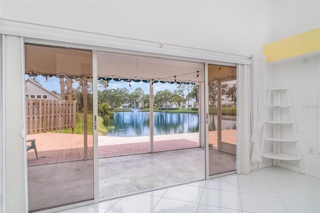 7833 Ontario Street Cir, Sarasota, FL 34243 - doorway featuring a water view, tile patterned floors, and plenty of natural light
