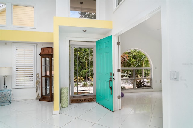 7833 Ontario Street Cir, Sarasota, FL 34243 - tiled entryway with a high ceiling and baseboards