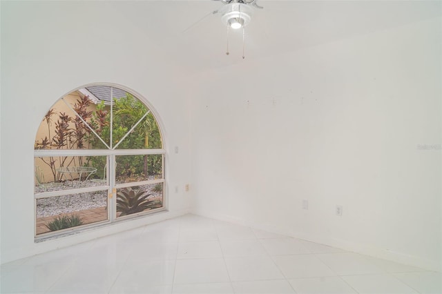 7833 Ontario Street Cir, Sarasota, FL 34243 - tiled empty room with ceiling fan and baseboards