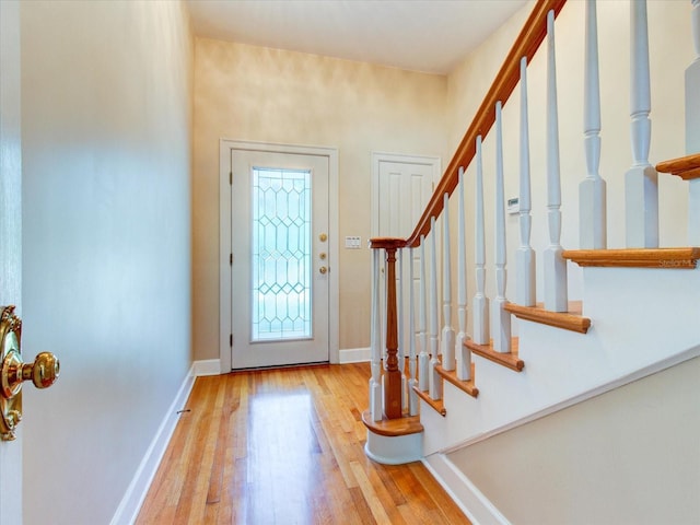 504 Riverside Dr Unit 504, Tarpon Springs, FL 34689 - foyer featuring wood finished floors, stairs, and baseboards