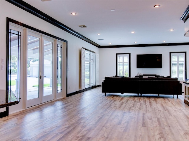 504 Riverside Dr Unit 504, Tarpon Springs, FL 34689 - living area with ornamental molding, light wood-style floors, french doors, baseboards, and recessed lighting