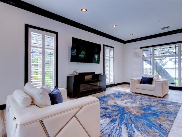 504 Riverside Dr Unit 504, Tarpon Springs, FL 34689 - living room with light wood finished floors, baseboards, ornamental molding, and recessed lighting