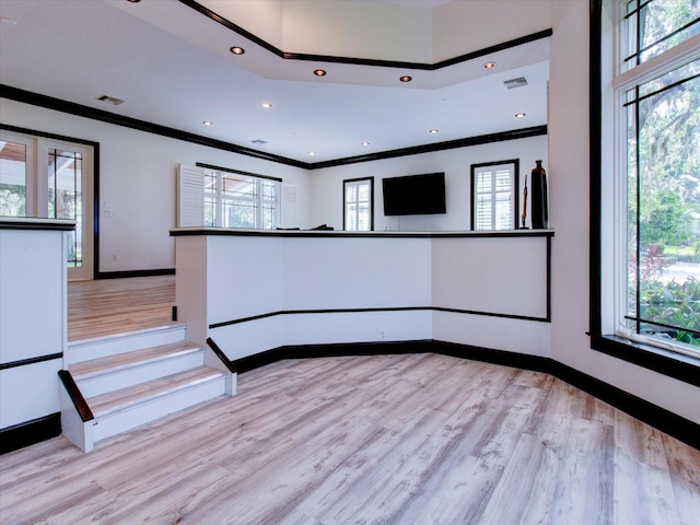 504 Riverside Dr Unit 504, Tarpon Springs, FL 34689 - interior space featuring crown molding, light wood finished floors, baseboards, and recessed lighting