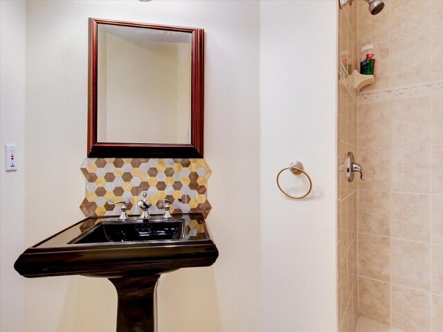 504 Riverside Dr Unit 504, Tarpon Springs, FL 34689 - full bathroom with tiled shower and decorative backsplash