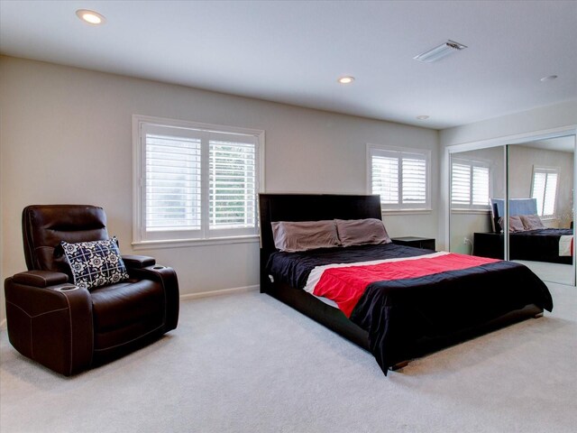 504 Riverside Dr Unit 504, Tarpon Springs, FL 34689 - carpeted bedroom featuring multiple windows, recessed lighting, baseboards, and a closet