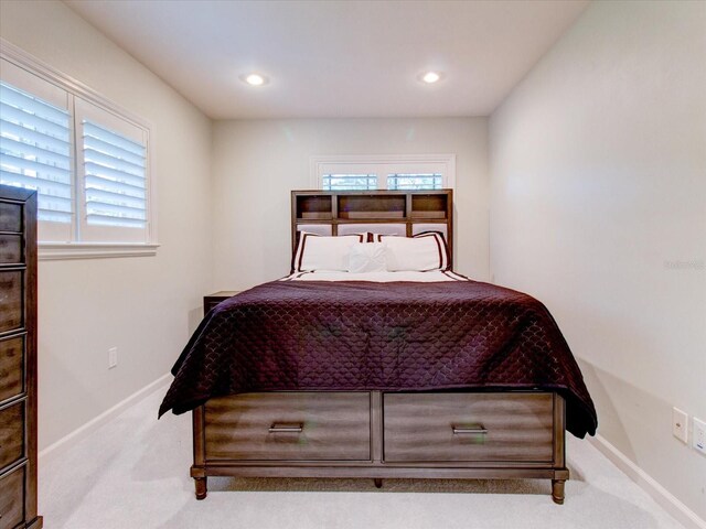 504 Riverside Dr Unit 504, Tarpon Springs, FL 34689 - bedroom with carpet flooring, baseboards, multiple windows, and recessed lighting