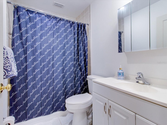504 Riverside Dr Unit 504, Tarpon Springs, FL 34689 - bathroom featuring vanity, toilet, and a shower with curtain