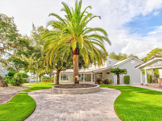 504 Riverside Dr Unit 504, Tarpon Springs, FL 34689 - view of front of property featuring a front lawn and stucco siding