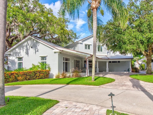 504 Riverside Dr Unit 504, Tarpon Springs, FL 34689 - view of front facade with a front lawn and brick siding