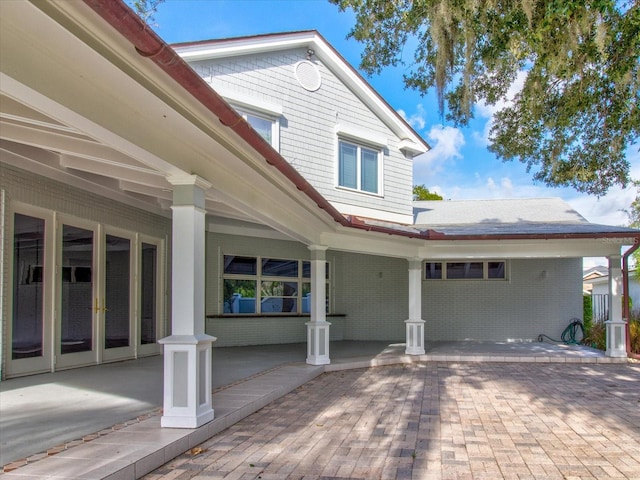 504 Riverside Dr Unit 504, Tarpon Springs, FL 34689 - view of front of property with brick siding and covered porch