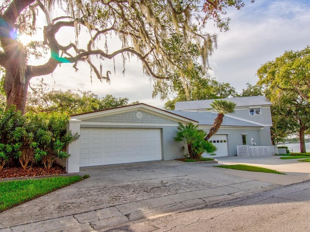 504 Riverside Dr Unit 504, Tarpon Springs, FL 34689 - view of front of house with driveway and a garage
